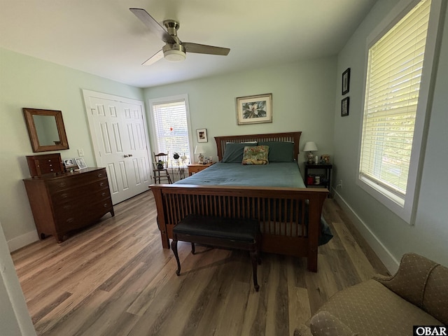51 Fish Camp Rd, Ocracoke, NC 27960 - bedroom with baseboards, a closet, ceiling fan, and wood finished floors
