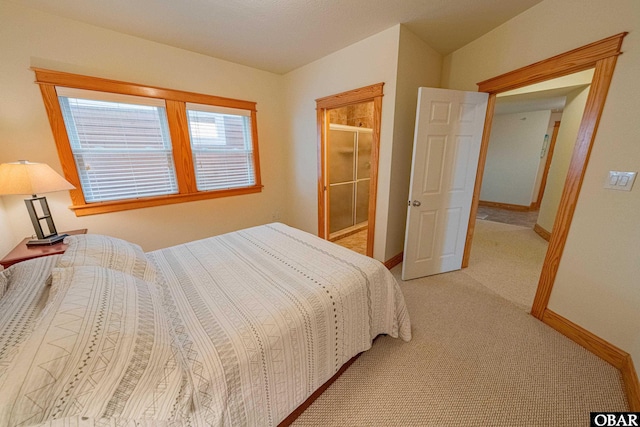 bedroom featuring light carpet and baseboards