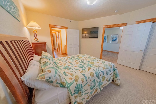 bedroom featuring light carpet