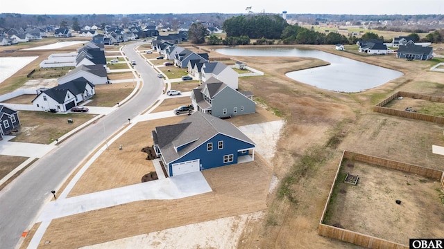 birds eye view of property with a residential view