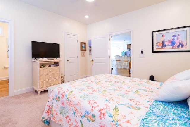 carpeted bedroom with baseboards and recessed lighting