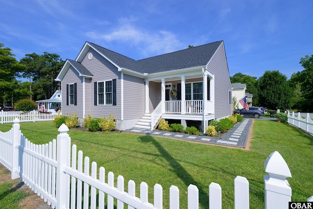 bungalow-style home featuring a fenced front yard, a front yard, and covered porch