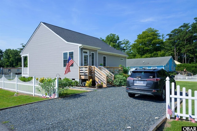 view of front facade featuring crawl space and fence