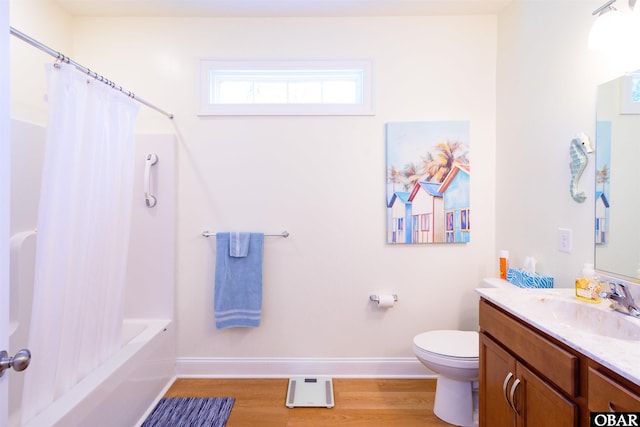 bathroom with shower / bathtub combination with curtain, toilet, vanity, wood finished floors, and baseboards