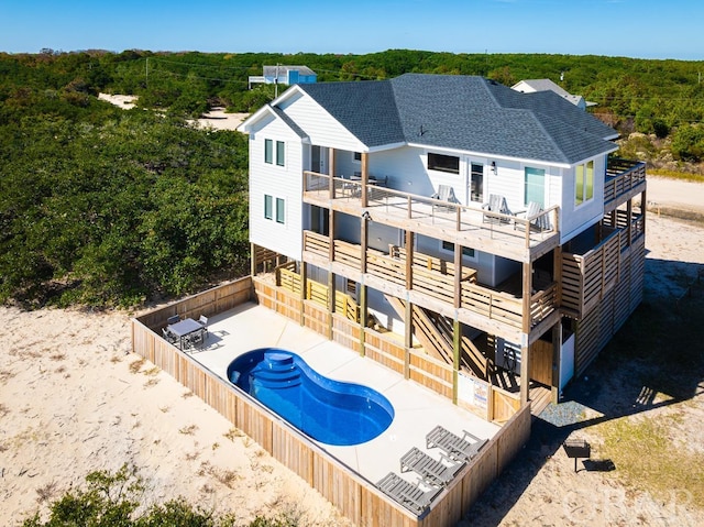 view of swimming pool with a fenced backyard, a fenced in pool, and a patio