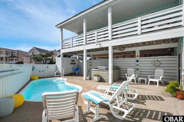 view of pool featuring a fenced in pool, a fenced backyard, and a patio area