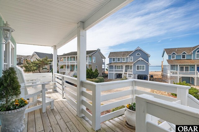 wooden terrace featuring a residential view