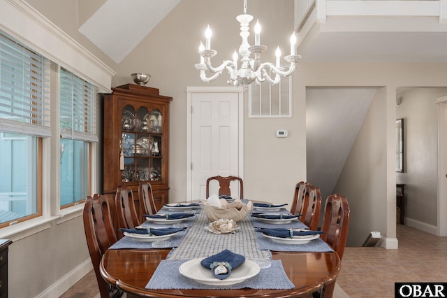 tiled dining room featuring baseboards, lofted ceiling, and a notable chandelier