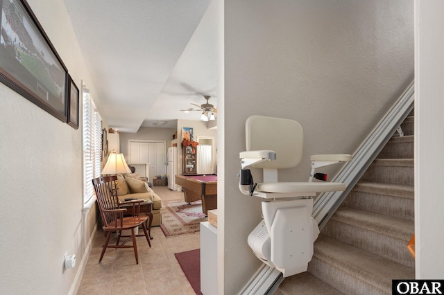 stairs with tile patterned floors, ceiling fan, billiards, and baseboards