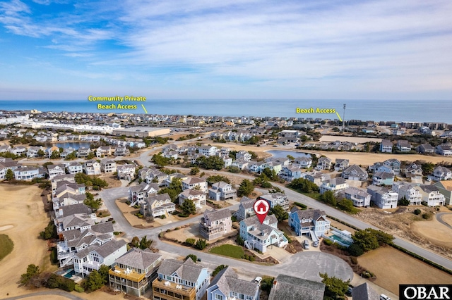 aerial view with a water view and a residential view