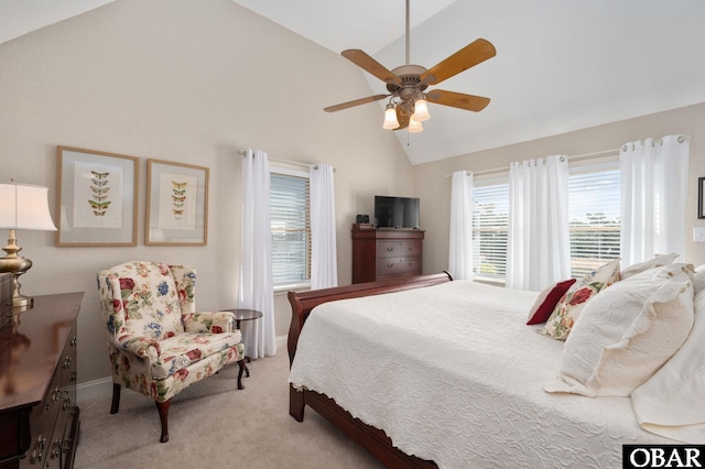 bedroom with light colored carpet, baseboards, a ceiling fan, and vaulted ceiling