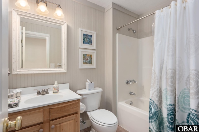 full bath with toilet, vanity, and shower / tub combo with curtain