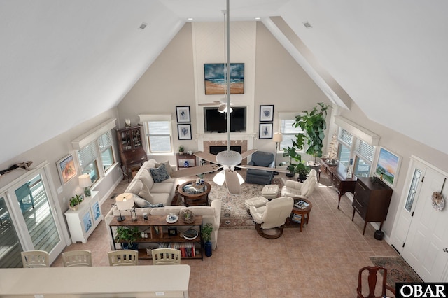 living room with high vaulted ceiling