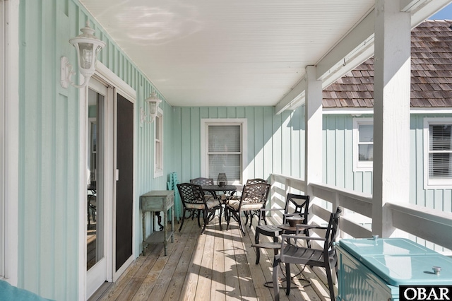 deck with outdoor dining area