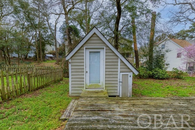 view of shed with fence