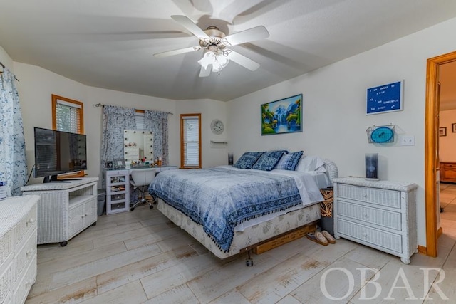 bedroom featuring light wood-style flooring and a ceiling fan