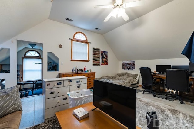 office area featuring visible vents, vaulted ceiling, and ceiling fan