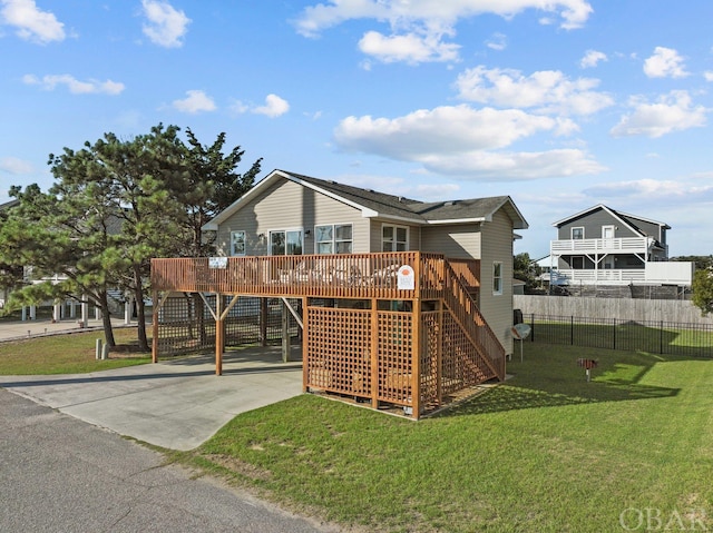 view of playground featuring stairs, a yard, a wooden deck, and fence