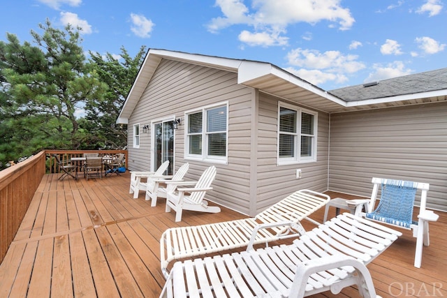 deck featuring outdoor dining area