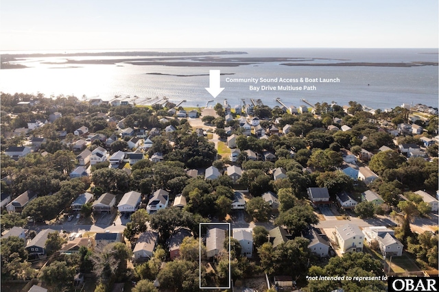 birds eye view of property with a residential view and a water view