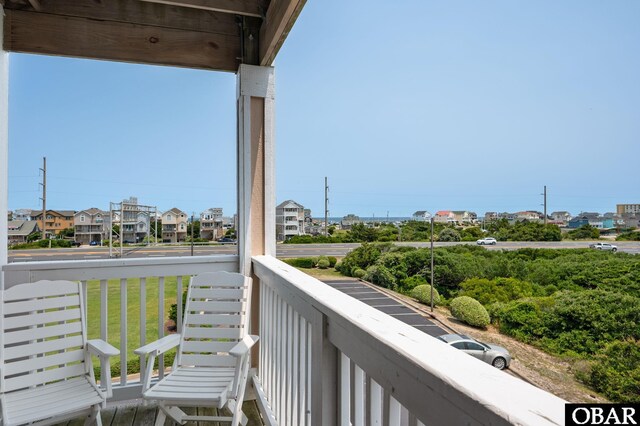 107 W Gray Eagle St Unit 213, Nags Head, NC 27959 - balcony featuring a residential view
