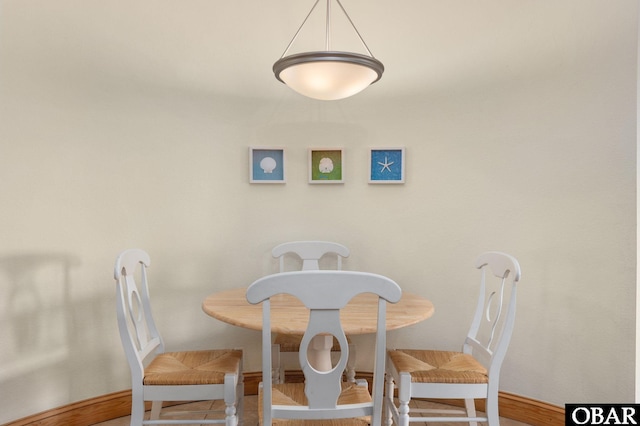 107 W Gray Eagle St Unit 213, Nags Head, NC 27959 - tiled dining room with baseboards