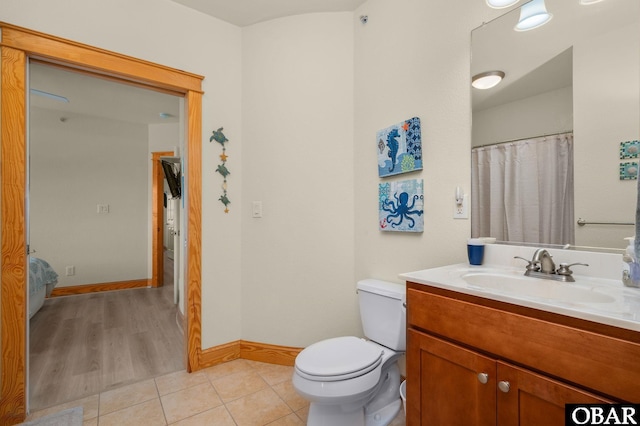 107 W Gray Eagle St Unit 213, Nags Head, NC 27959 - full bath with vanity, toilet, tile patterned flooring, and baseboards