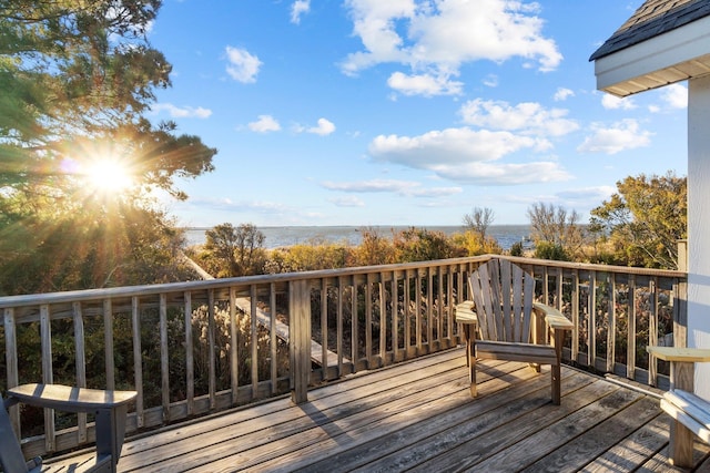 wooden deck featuring a water view