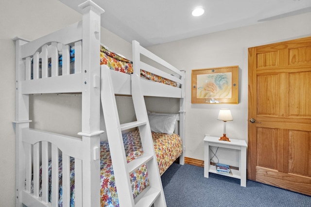 carpeted bedroom with baseboards