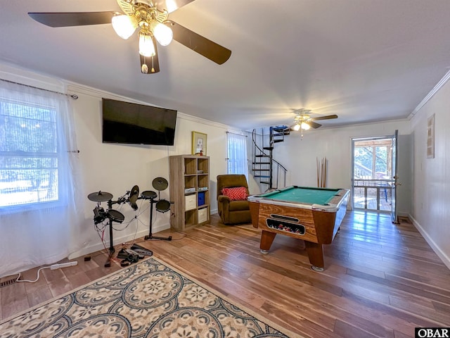 rec room with crown molding, ceiling fan, baseboards, pool table, and wood finished floors