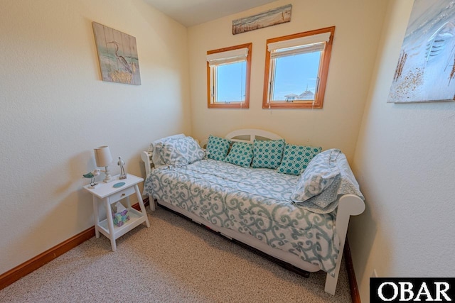 bedroom with carpet and baseboards