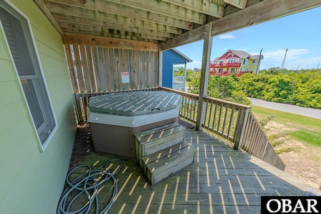 wooden terrace with a hot tub