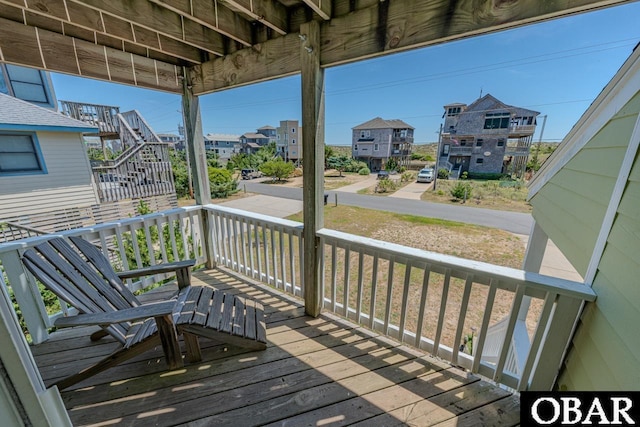 wooden terrace with a porch