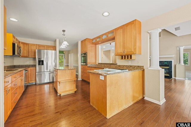 4 Birch Ln Lot 15, Southern Shores, NC 27949 - kitchen with appliances with stainless steel finishes, dark wood finished floors, a premium fireplace, light stone countertops, and recessed lighting