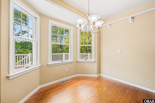 4 Birch Ln Lot 15, Southern Shores, NC 27949 - spare room featuring a chandelier and hardwood / wood-style floors