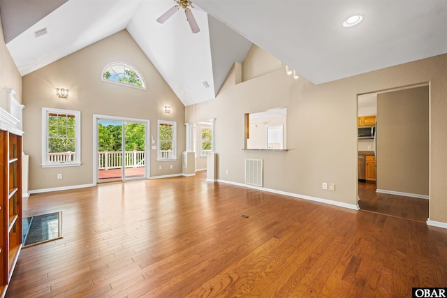 4 Birch Ln Lot 15, Southern Shores, NC 27949 - unfurnished living room with ceiling fan, hardwood / wood-style floors, healthy amount of natural light, and high vaulted ceiling