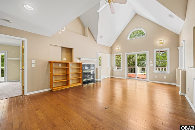 4 Birch Ln Lot 15, Southern Shores, NC 27949 - unfurnished living room with a premium fireplace, hardwood / wood-style flooring, plenty of natural light, a ceiling fan, and high vaulted ceiling