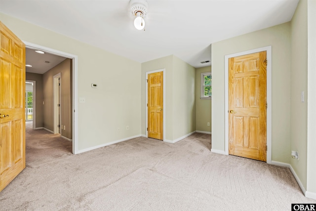 4 Birch Ln Lot 15, Southern Shores, NC 27949 - unfurnished bedroom featuring light carpet and multiple windows