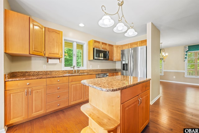 4 Birch Ln Lot 15, Southern Shores, NC 27949 - kitchen featuring stainless steel appliances, a chandelier, light wood finished floors, and a center island