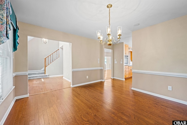 4 Birch Ln Lot 15, Southern Shores, NC 27949 - empty room featuring a chandelier, wood finished floors, and stairway
