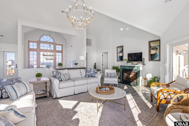 54053 Sandpiper Dr Lot 4, Frisco, NC 27936 - living room featuring high vaulted ceiling, wood finished floors, a chandelier, and a high end fireplace