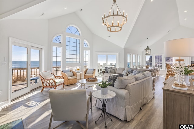 54053 Sandpiper Dr Lot 4, Frisco, NC 27936 - living room featuring high vaulted ceiling, wood finished floors, and a chandelier
