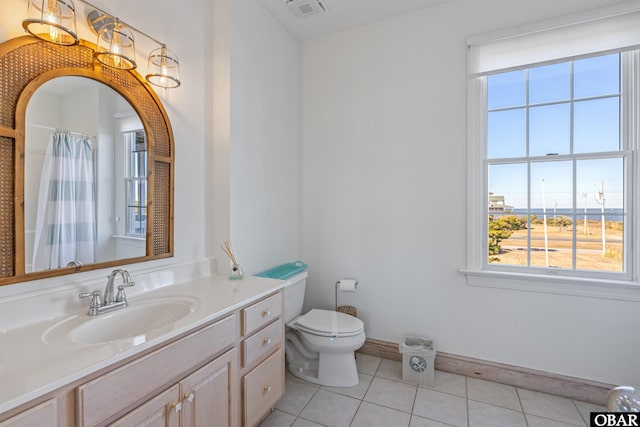 54053 Sandpiper Dr Lot 4, Frisco, NC 27936 - full bathroom with tile patterned floors, toilet, baseboards, vanity, and a shower with shower curtain