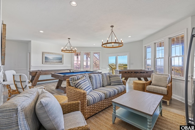 54053 Sandpiper Dr Lot 4, Frisco, NC 27936 - living area featuring billiards table, wainscoting, a chandelier, recessed lighting, and light wood-style floors