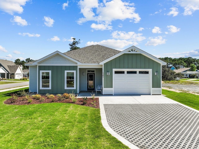 view of front facade featuring driveway, board and batten siding, and an attached garage