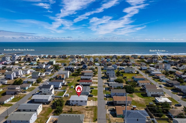 bird's eye view featuring a water view and a residential view