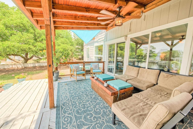 exterior space featuring vaulted ceiling with beams, wood ceiling, and ceiling fan