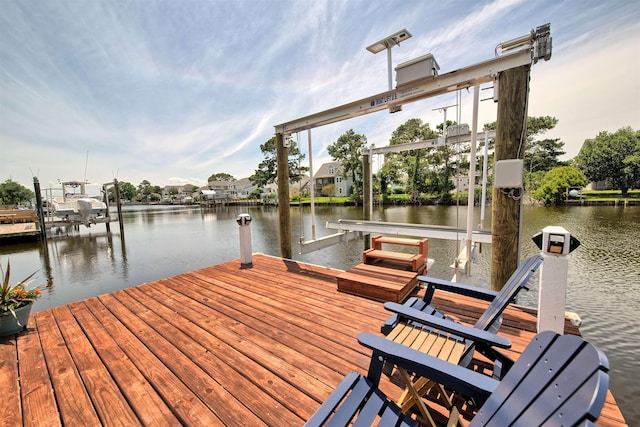 view of dock with a water view and boat lift