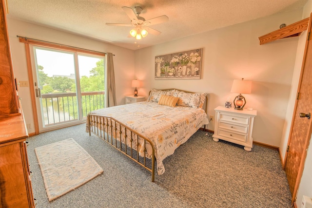 bedroom featuring baseboards, access to outside, dark carpet, and a textured ceiling