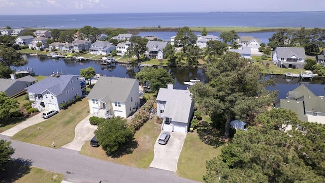 bird's eye view featuring a residential view and a water view